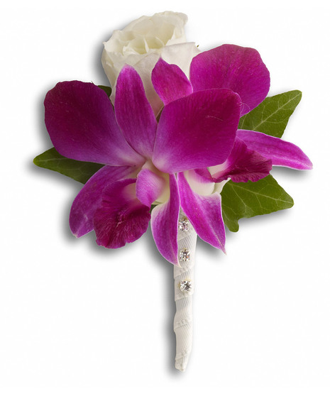 Boutonniere created with a fuchsia orchid and white rose