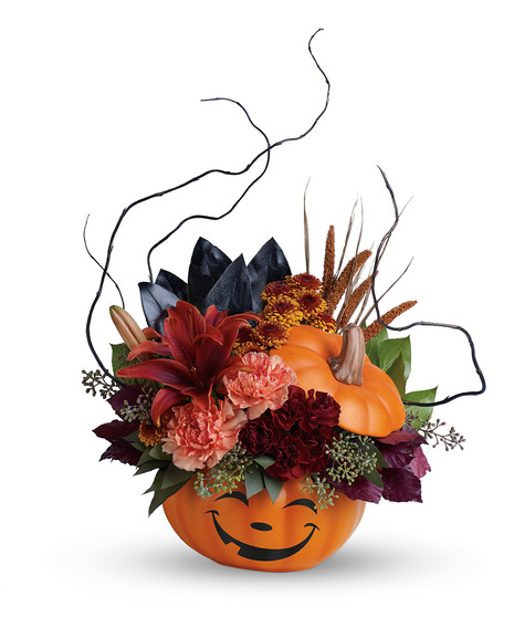 Halloween bouquet of lilies, carnations, mums and fall accents in a ceramic pumpkin vase